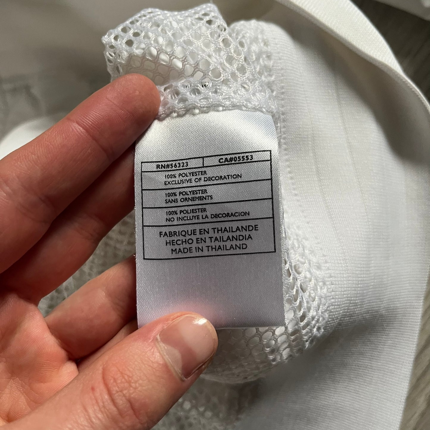 Nike Japan Olympics Split Windbreaker from 2008, created by designer Jarrett Reynolds. Crafted in white with a large red circle representing Japan’s flag, this innovative jacket can be zipped apart on both sides and merged with other compatible models. Hidden inside, a small Japan flag accent completes the concept.