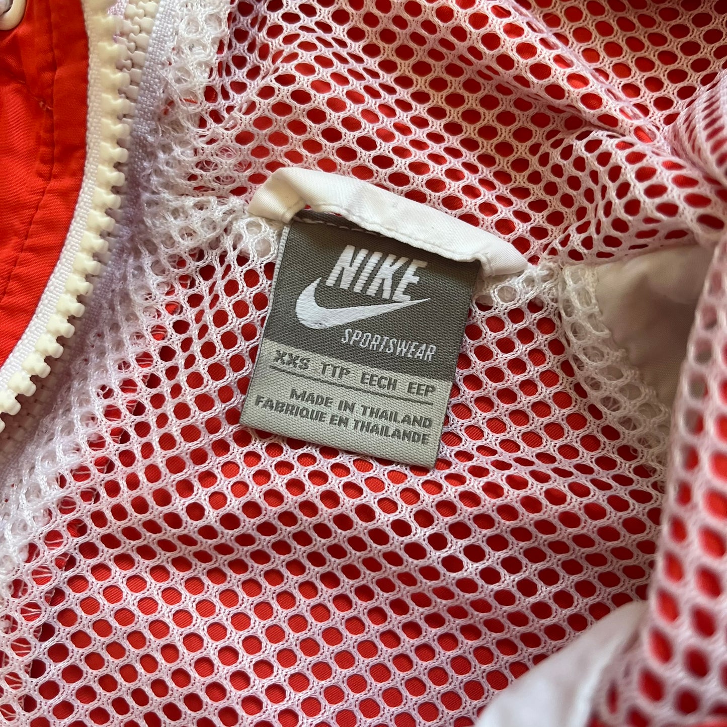 Nike Mexico Olympics Split Windbreaker from 2008, created by designer Jarrett Reynolds. Crafted in green/white/red, with a white lower half, red upper half and green hems/shoulders. Small Nike red embroidery finishes the jacket design. This innovative jacket can be zipped apart on both sides and merged with other compatible models.