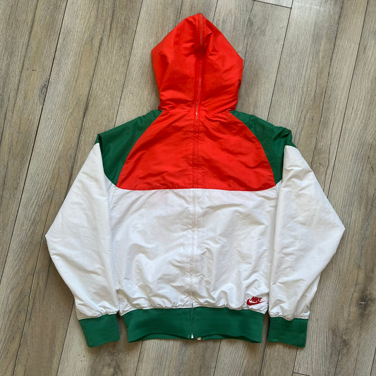 Nike Mexico Olympics Split Windbreaker from 2008, created by designer Jarrett Reynolds. Crafted in green/white/red, with a white lower half, red upper half and green hems/shoulders. Small Nike red embroidery finishes the jacket design. This innovative jacket can be zipped apart on both sides and merged with other compatible models.