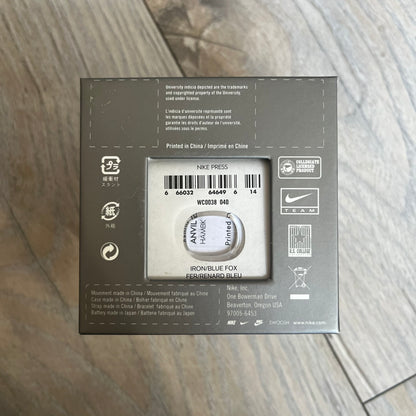 Nike Oregon Series Gray Digital Watch WA0036-441 is a digital wristwatch featuring a rectangular display with a stainless steel frame and a dark grey rubber strap with stainless steel clasp. The watch includes four side buttons, backlight function, and displays black digital numerals, with a small Nike logo on the metal bezel. It is water resistant up to 100 meters, powered by fresh batteries, and comes with original tag and box.