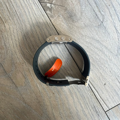 Nike Oregon Series Gray Digital Watch is a digital wristwatch featuring a rectangular display with a stainless steel frame and a dark grey rubber strap with stainless steel clasp. The watch includes four side buttons, backlight function, and displays black digital numerals, with a small Nike logo on the metal bezel. It is water resistant up to 100 meters, powered by fresh batteries, and comes with original tag and box.