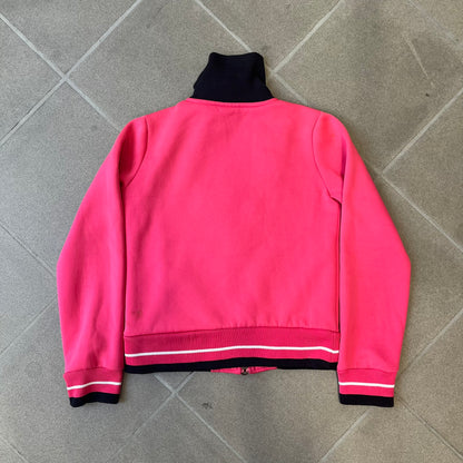 Nike Pink Women's Bomber-style Zip-up features a pink, heavyweight cotton construction with a tall black collar. It has a full front zipper with a circular zipper pull and two front Velcro pockets, one with a small Nike tag. The garment has a jacket-style construction.

