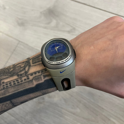 Nike Sports Chrono Cross Training Watch featuring a unique ana-digi design with a Blue Analog face. The display combines a three-hand analog setup with a curved dual-section LCD showing time, day, and mode. Water-resistant up to 50m and equipped with chronograph, timer, alarm, and dual-time functions.