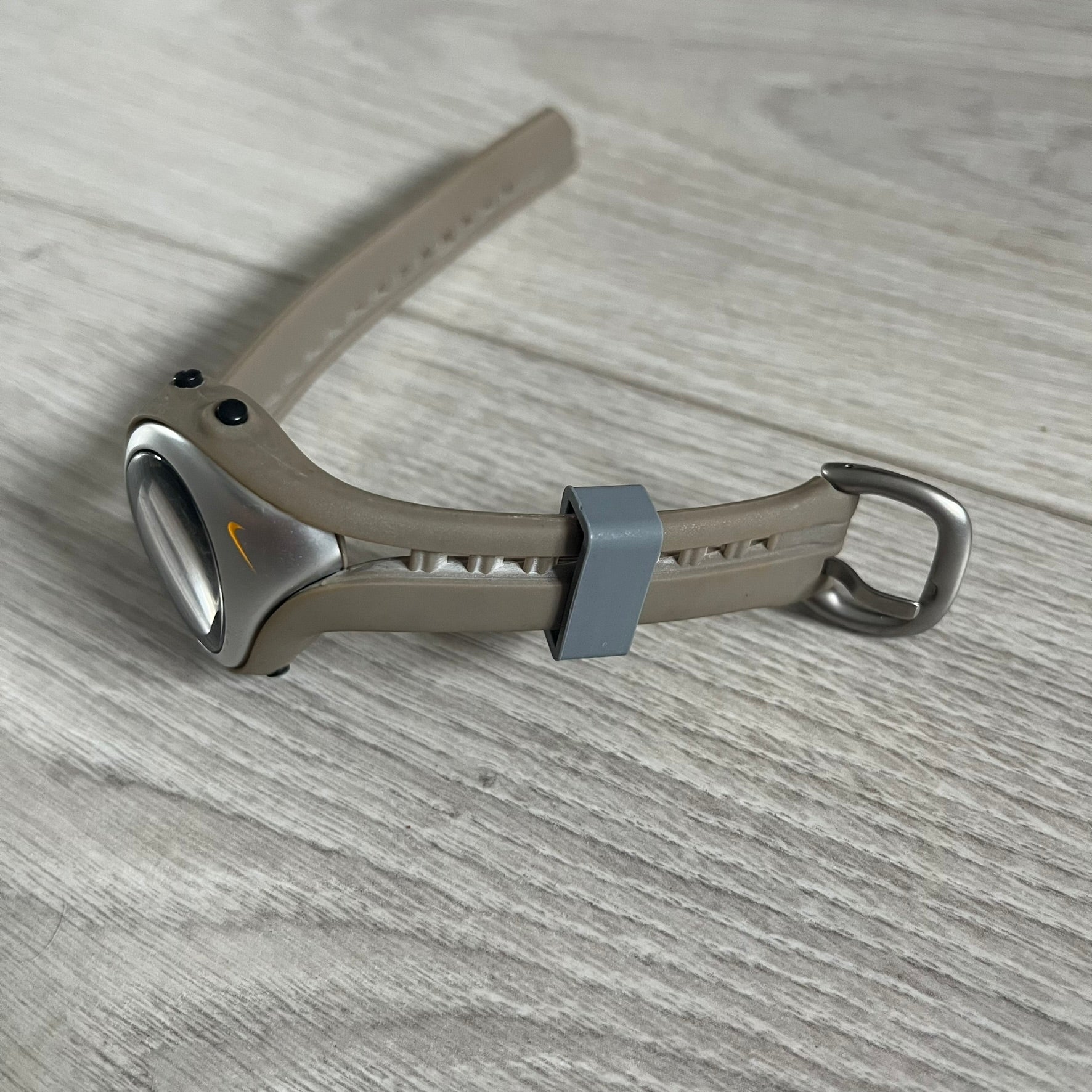 Metallic tool on a wooden surface