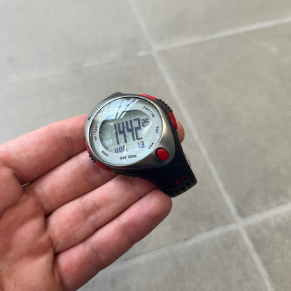 Nike Triax Speed 100 Regular Red Digital Watch features a silver-tone case with four red side buttons and a front button for the backlight function. The watch has an black Nike Swoosh on the top of the case, 100-lap memory, multiple modes, and 100m water resistance. It comes with brown-ish bracelet.
