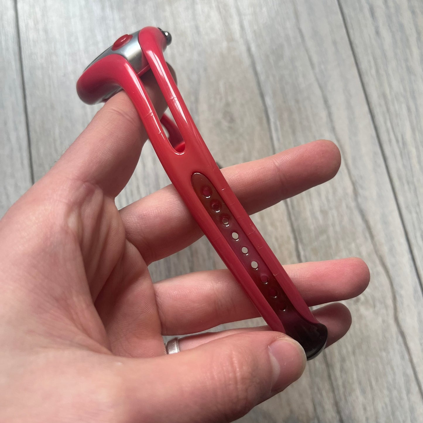 Nike Triax Swift WR0078 analog wristwatch with pink rubber straps and a matching rubber outer case. The internal case is silver-tone metal, fitted with a pink front button and pink Nike Swoosh branding. Features a black dotted dial with silver hands and markers. Sport-oriented construction with a clean, functional layout typical of early-2000s Nike Triax models.