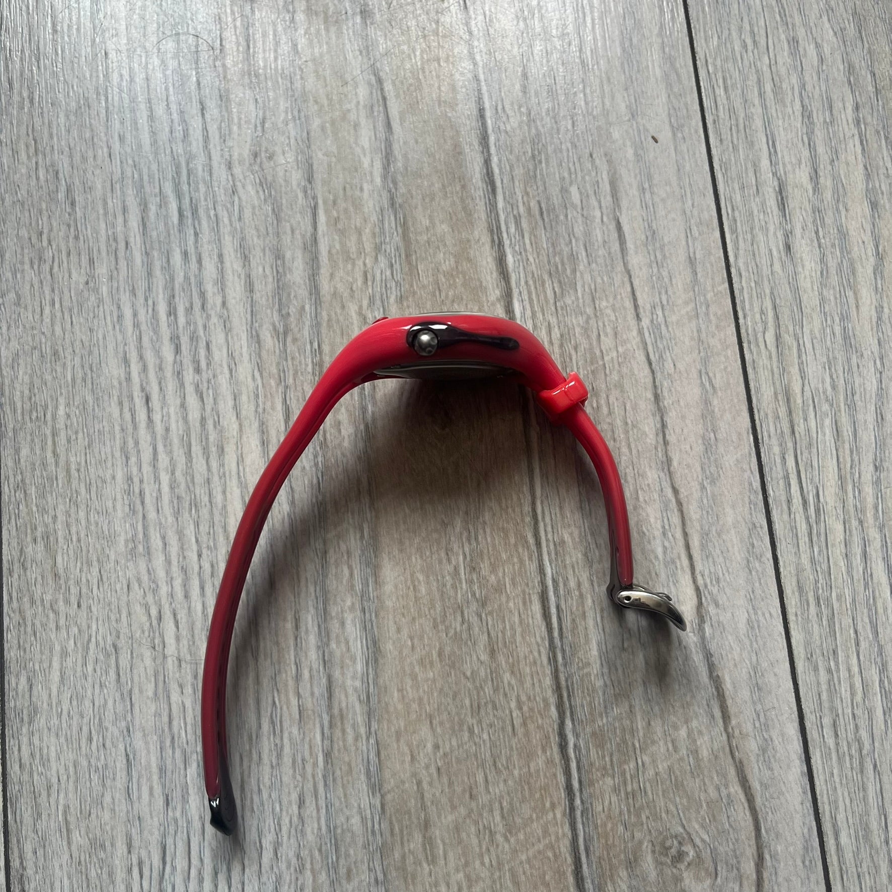 Nike Triax Swift WR0078 analog wristwatch with pink rubber straps and a matching rubber outer case. The internal case is silver-tone metal, fitted with a pink front button and pink Nike Swoosh branding. Features a black dotted dial with silver hands and markers. Sport-oriented construction with a clean, functional layout typical of early-2000s Nike Triax models.