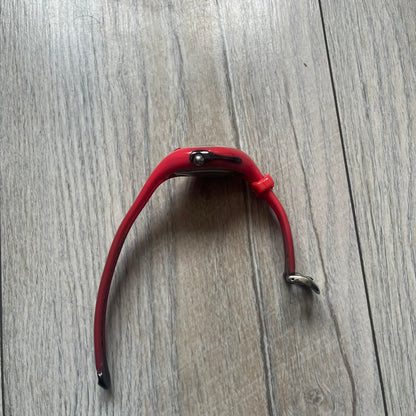 Nike Triax Swift WR0078 analog wristwatch with pink rubber straps and a matching rubber outer case. The internal case is silver-tone metal, fitted with a pink front button and pink Nike Swoosh branding. Features a black dotted dial with silver hands and markers. Sport-oriented construction with a clean, functional layout typical of early-2000s Nike Triax models.