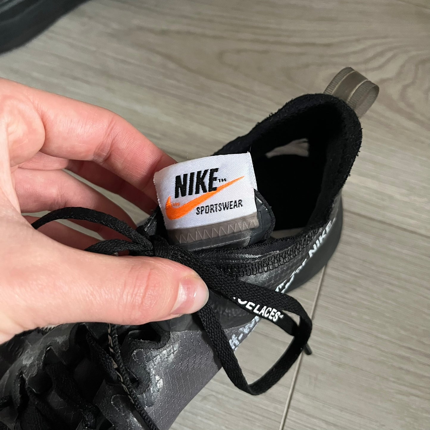 The Nike Zoom Fly Off-White Black Silver (AJ4588-001) reimagines Nike’s running silhouette through Virgil Abloh’s distinct Off-White lens. Built with a semi-translucent upper, black midsole, and bold white Swoosh, this 2018 release merges high-fashion design with advanced running technology.