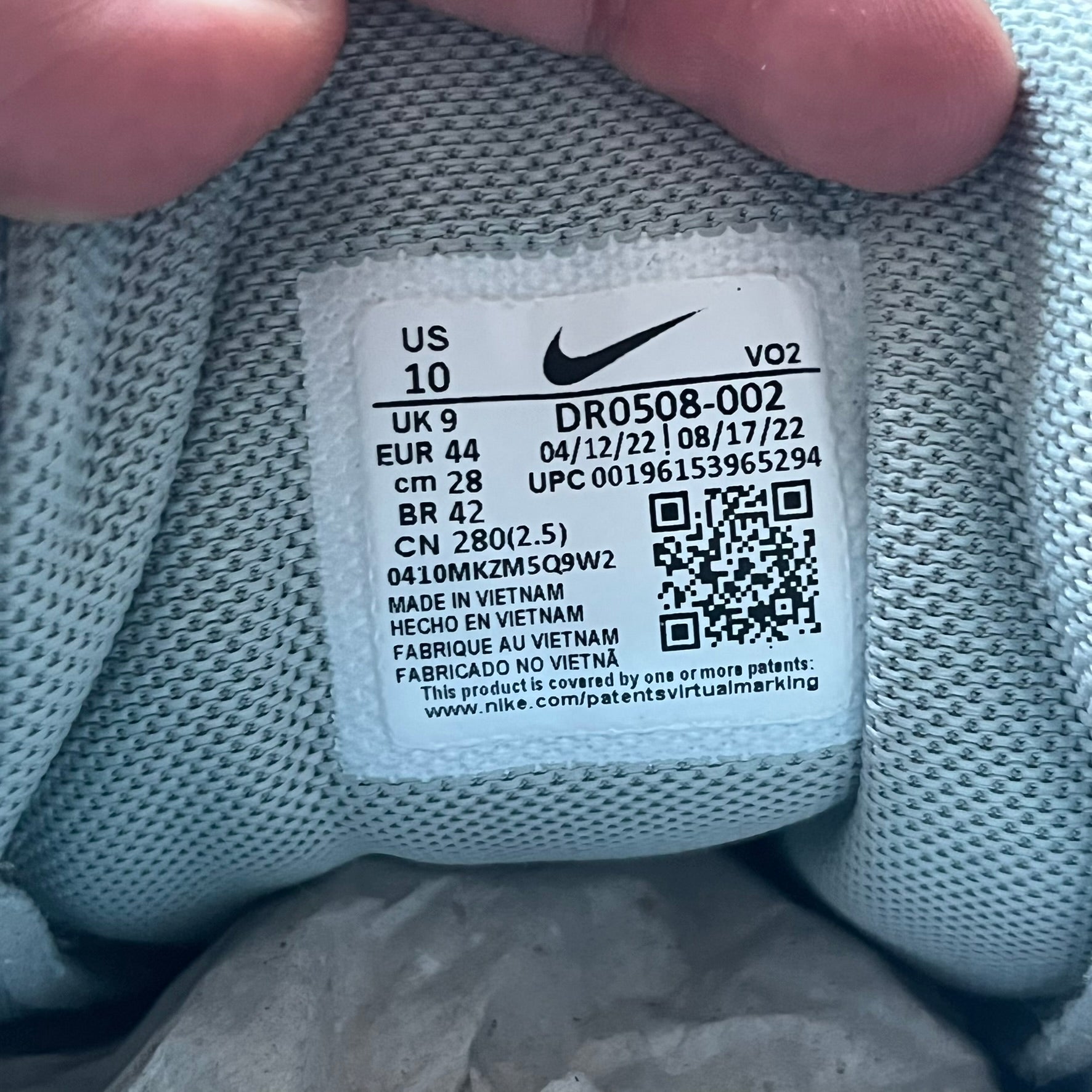 The Nike x NOCTA Hot Step Air Terra “Snakeskin” Light Pumice Sneakers feature a low-top build with a faux snakeskin-textured upper in light pumice blue and grey tones. Details include small 3D mini Swooshes on the sides, reflective piping around the eyestay, oval perforations at the midfoot with a reflective underlay, and NOCTA branding on the tongue and insole. Finished with a white foam midsole inspired by the Air Terra Humara with Zoom Air in the forefoot, a visible Max Air unit in the heel, and a gum ru