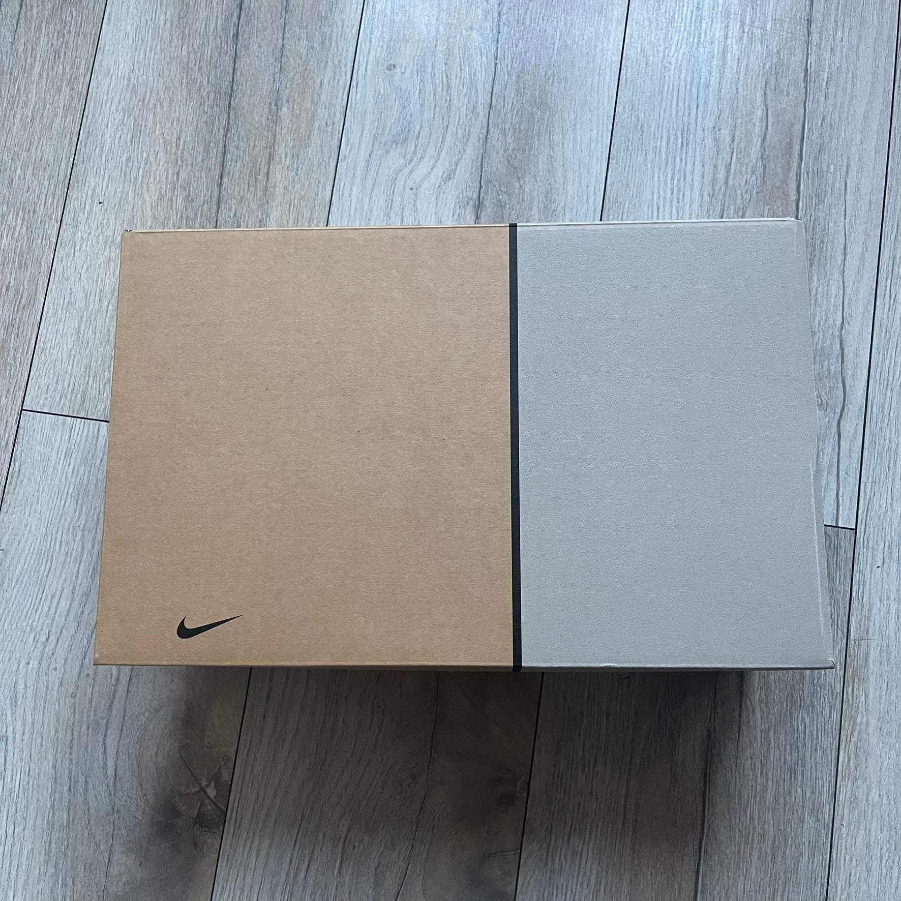 The Nike x NOCTA Hot Step Air Terra “Snakeskin” Light Pumice Sneakers feature a low-top build with a faux snakeskin-textured upper in light pumice blue and grey tones. Details include small 3D mini Swooshes on the sides, reflective piping around the eyestay, oval perforations at the midfoot with a reflective underlay, and NOCTA branding on the tongue and insole. Finished with a white foam midsole inspired by the Air Terra Humara with Zoom Air in the forefoot, a visible Max Air unit in the heel, and a gum ru