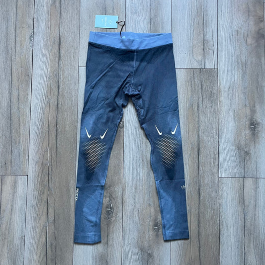 Nike x NOCTA Dri-FIT “Cobalt Bliss” Tights Pants DV3657-479 are men’s slim-fit track tights released on November 8, 2023, as part of the SU2023 collection. The tights feature a Cobalt Bliss blue colorway with light and dark blue (grey-toned) heat map-style patterning throughout, finished with white Nike and NOCTA logos.&nbsp;Constructed with Nike Dri-FIT fabric, they include an elastic waistband with a regular rise and a skinny fit.