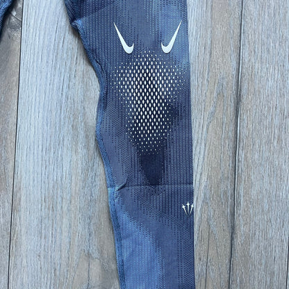 Nike x NOCTA Dri-FIT “Cobalt Bliss” Tights Pants DV3657-479 are men’s slim-fit track tights released on November 8, 2023, as part of the SU2023 collection. The tights feature a Cobalt Bliss blue colorway with light and dark blue (grey-toned) heat map-style patterning throughout, finished with white Nike and NOCTA logos.&nbsp;Constructed with Nike Dri-FIT fabric, they include an elastic waistband with a regular rise and a skinny fit.