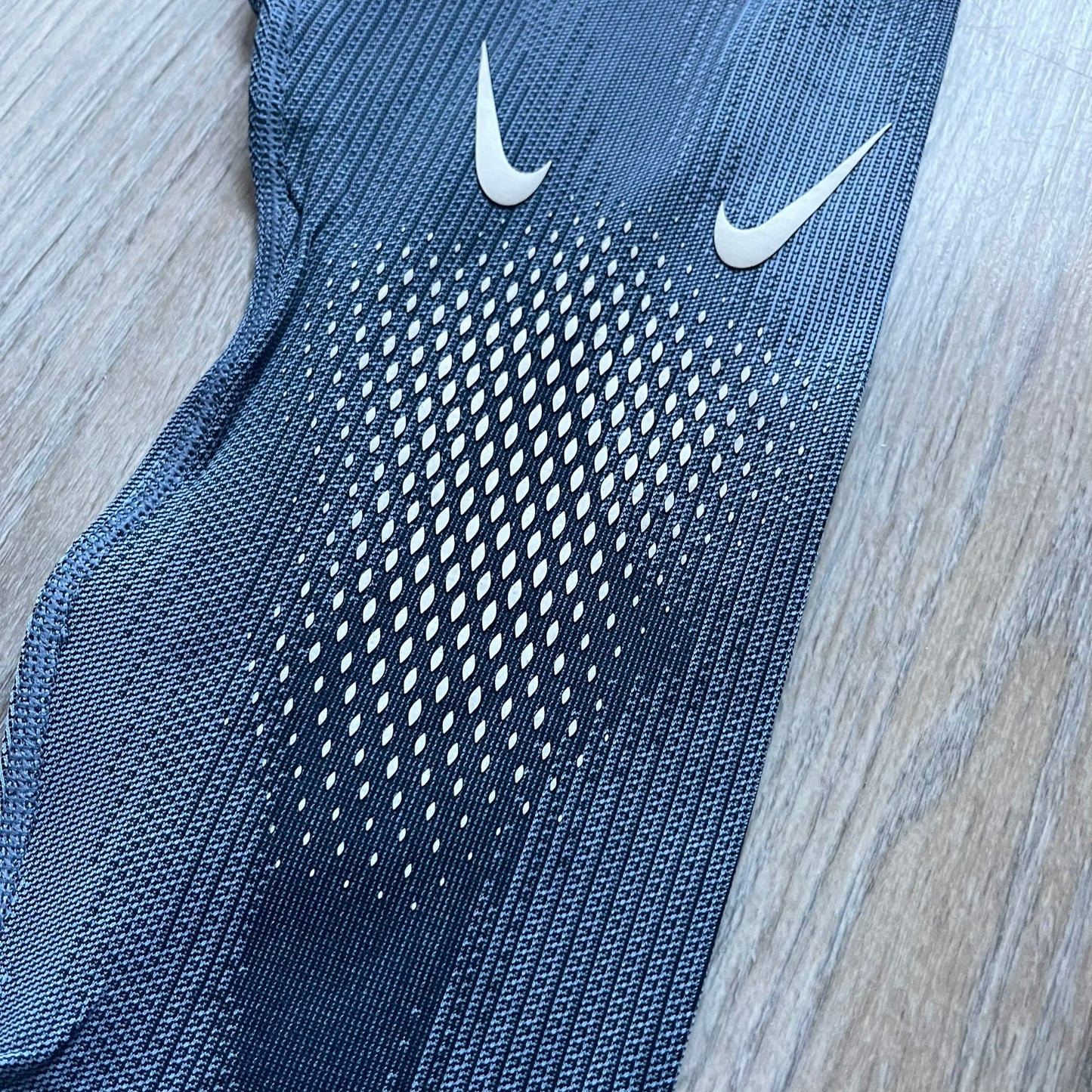 Nike x NOCTA Dri-FIT “Cobalt Bliss” Tights Pants DV3657-479 are men’s slim-fit track tights released on November 8, 2023, as part of the SU2023 collection. The tights feature a Cobalt Bliss blue colorway with light and dark blue (grey-toned) heat map-style patterning throughout, finished with white Nike and NOCTA logos.&nbsp;Constructed with Nike Dri-FIT fabric, they include an elastic waistband with a regular rise and a skinny fit.