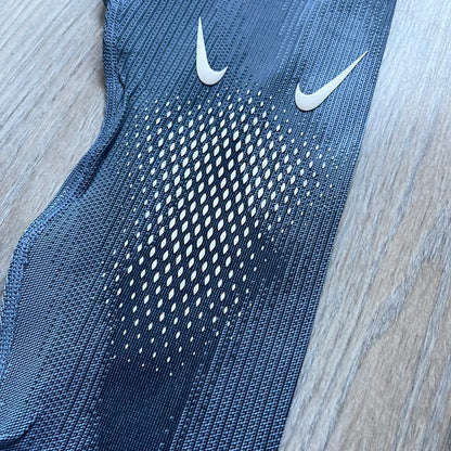 Nike x NOCTA Dri-FIT “Cobalt Bliss” Tights Pants DV3657-479 are men’s slim-fit track tights released on November 8, 2023, as part of the SU2023 collection. The tights feature a Cobalt Bliss blue colorway with light and dark blue (grey-toned) heat map-style patterning throughout, finished with white Nike and NOCTA logos.&nbsp;Constructed with Nike Dri-FIT fabric, they include an elastic waistband with a regular rise and a skinny fit.