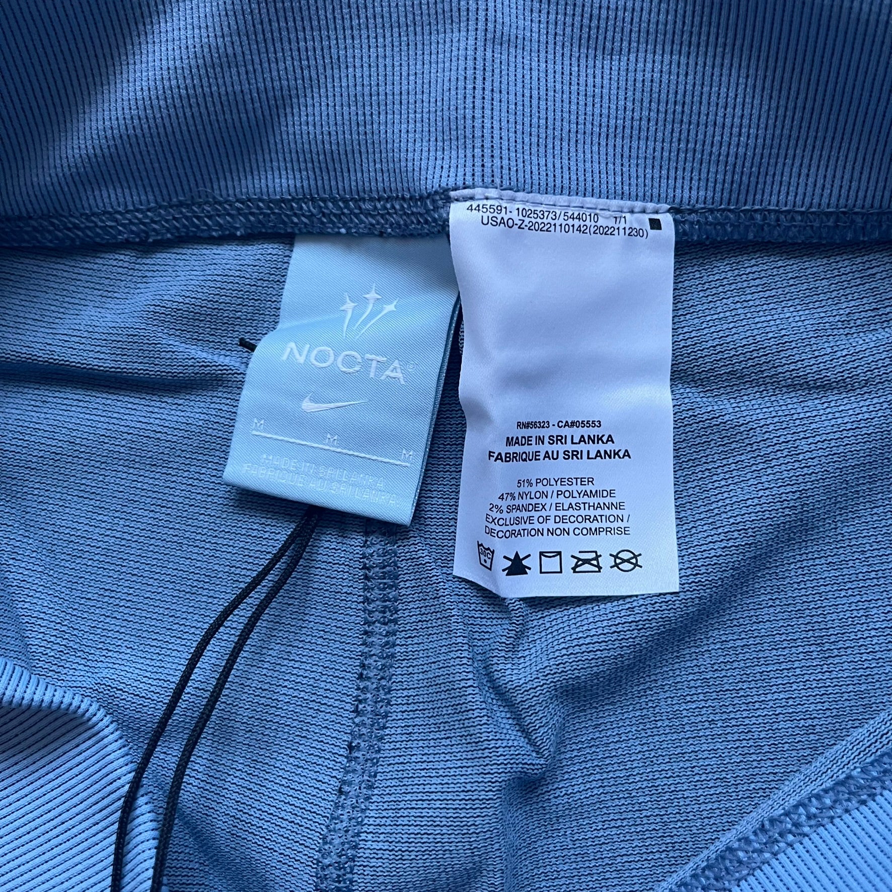 Nike x NOCTA Dri-FIT “Cobalt Bliss” Tights Pants DV3657-479 are men’s slim-fit track tights released on November 8, 2023, as part of the SU2023 collection. The tights feature a Cobalt Bliss blue colorway with light and dark blue (grey-toned) heat map-style patterning throughout, finished with white Nike and NOCTA logos.&nbsp;Constructed with Nike Dri-FIT fabric, they include an elastic waistband with a regular rise and a skinny fit.