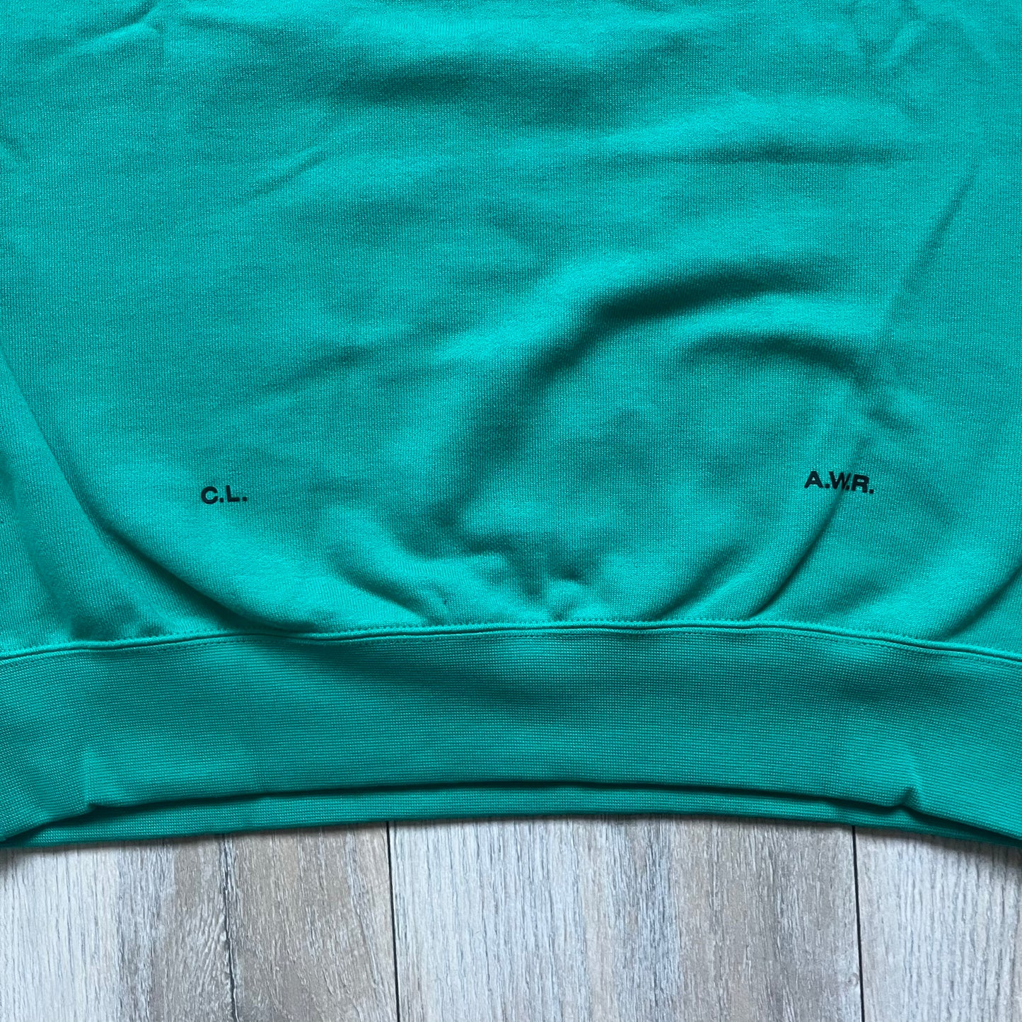 Nike x NOCTA Fleece “Neptune Green” Crewneck Sweatshirt FN8160-370 is a men’s pullover from the Cardinal Stock collection, finished in a Neptune Green/Black colorway. It features a regular fit with a round neckline, long sleeves, elastic cuffs, and an elasticated lower hem.&nbsp;Made from 82% cotton and 18% polyester fleece, the sweatshirt includes a silicone Swoosh logo and signature NOCTA branding, along with a back print, sleeve print, and 3D logo detailing. Made in Vietnam.