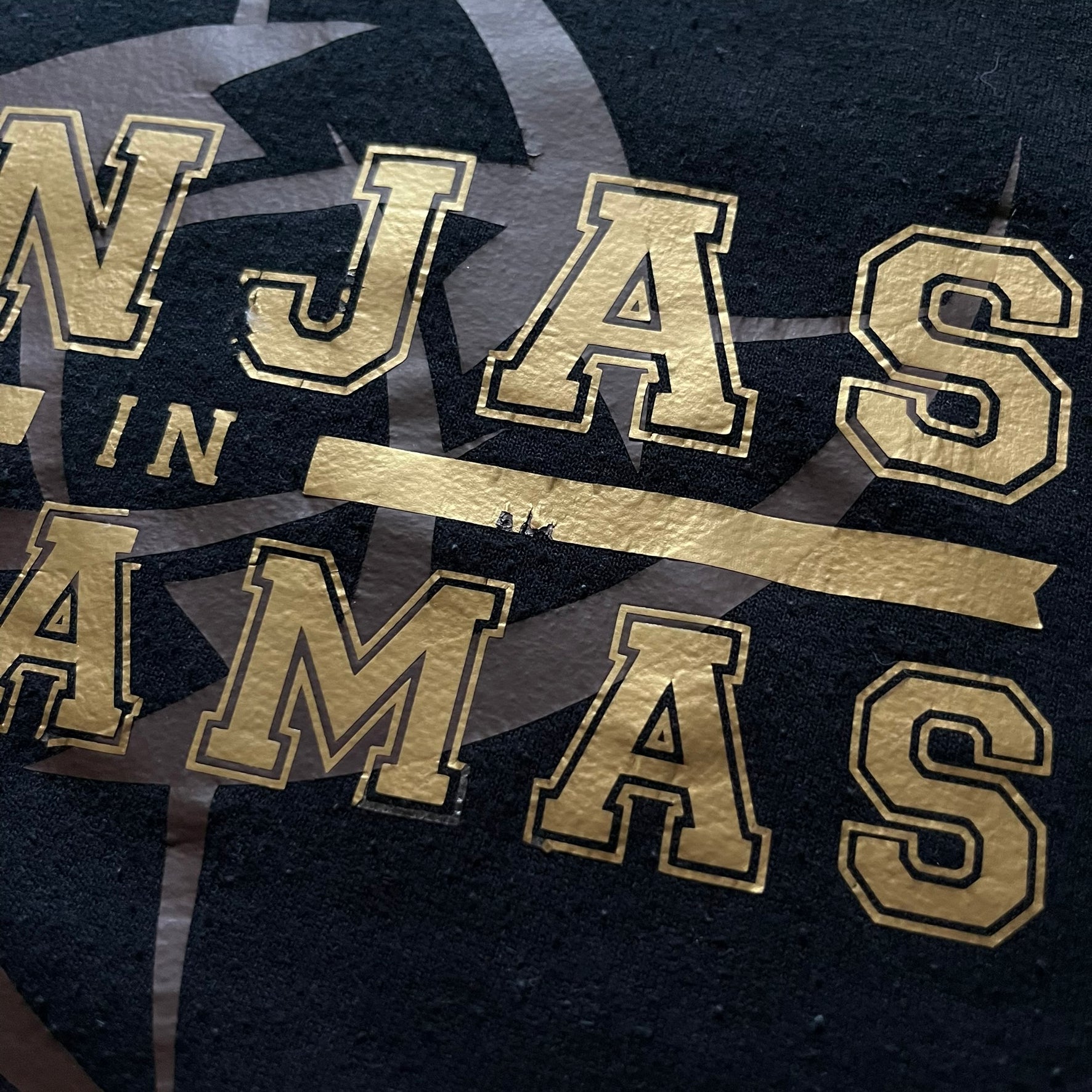 Ninjas In Pyjamas 2010’s Black Hoodie featuring the classic brown NIP logo with gold “Ninjas in Pyjamas” text across the front. Made on a Gildan Heavy Blend blank with a front pocket and adjustable hood. A vintage piece representing one of CS:GO’s most iconic teams.