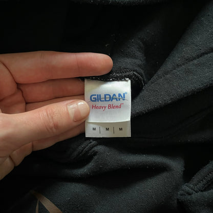 Ninjas In Pyjamas 2010’s Black Hoodie featuring the classic brown NIP logo with gold “Ninjas in Pyjamas” text across the front. Made on a Gildan Heavy Blend blank with a front pocket and adjustable hood. A vintage piece representing one of CS:GO’s most iconic teams.