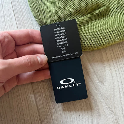 Oakley Ellipse Beanie Green crafted from soft 100% acrylic fabric with a reversible two-sided build. Includes Oakley’s signature Center black ellipse logo on the front. Designed for casual wear and outdoor performance with reliable warmth and fit.