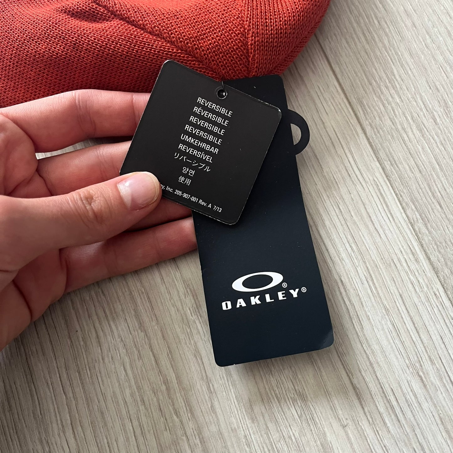 Oakley Side Ellipse beanie in flame red featuring a tilted lighter red O ellipse logo on the side. Reversible design and 100% acrylic construction make it both versatile and cozy. A clean, standout piece for casual and outdoor looks.