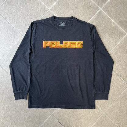 Palace FW18 Mazin Black Longsleeve features a black 100% cotton construction with a Palace logo printed on the chest. The logo is made from a maze-style graphic in yellow and red. Released on November 23, 2018.