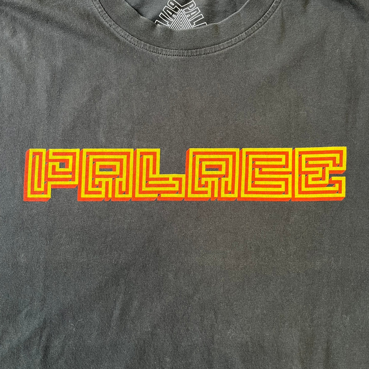 Palace FW18 Mazin Black Longsleeve features a black 100% cotton construction with a Palace logo printed on the chest. The logo is made from a maze-style graphic in yellow and red. Released on November 23, 2018.