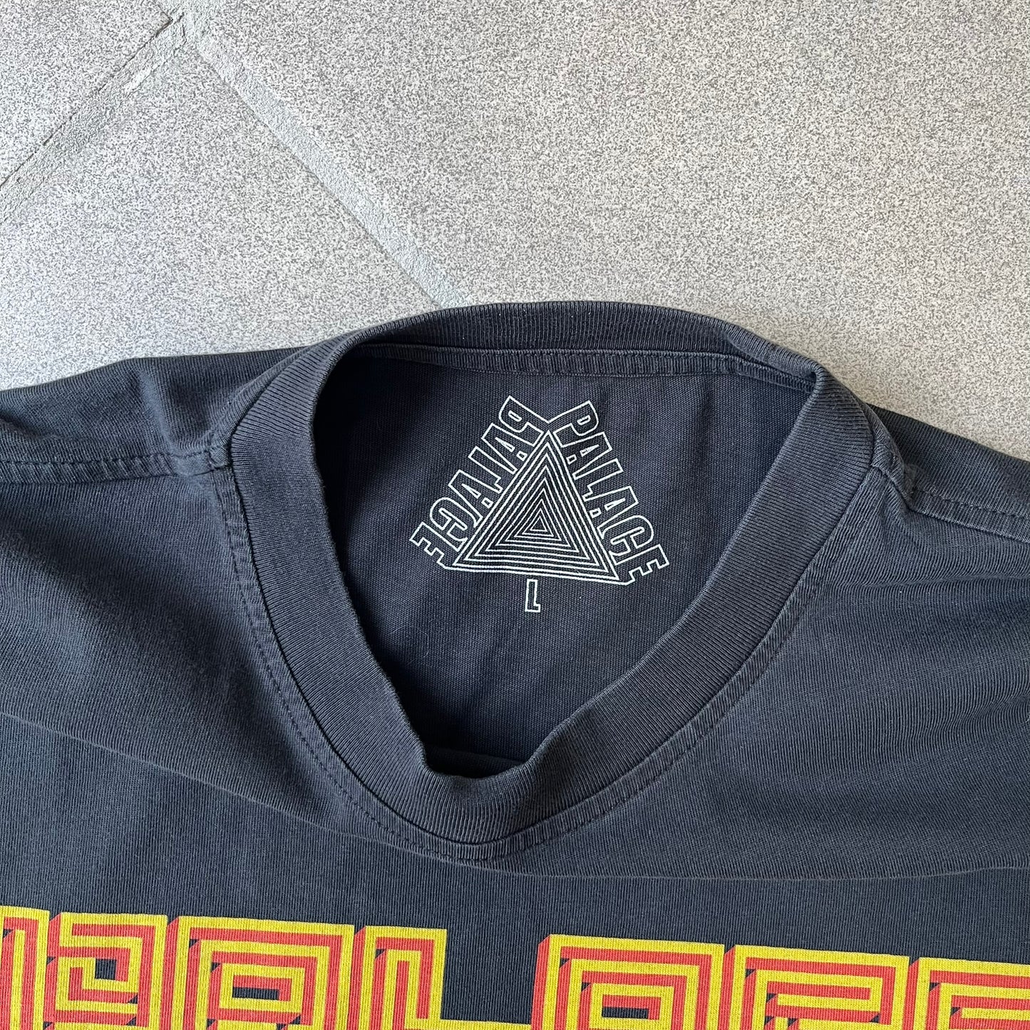 Palace FW18 Mazin Black Longsleeve features a black 100% cotton construction with a Palace logo printed on the chest. The logo is made from a maze-style graphic in yellow and red. Released on November 23, 2018.