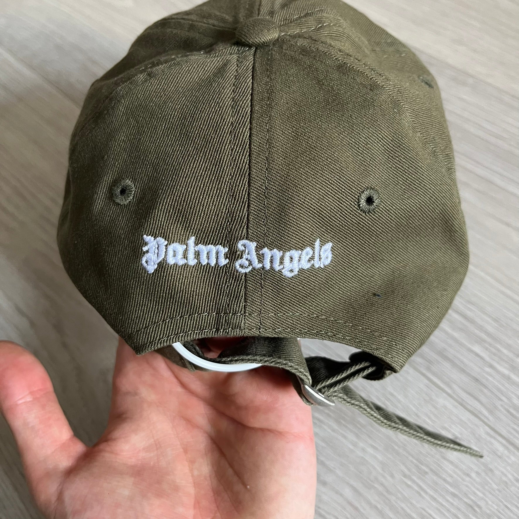 Palm Angels Classic Logo Khaki Baseball Cap made from 100% cotton with white embroidered Palm Angels lettering on both the front and back. Designed with gothic-inspired typography, this cap delivers a clean, minimal look with a streetwear edge.