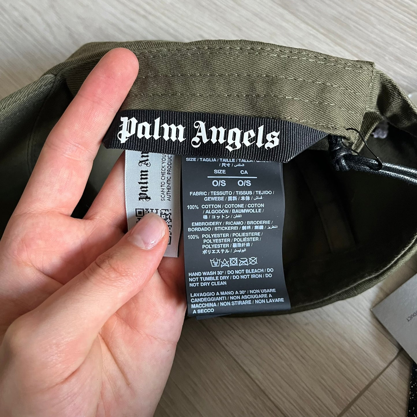 Palm Angels Classic Logo Khaki Baseball Cap made from 100% cotton with white embroidered Palm Angels lettering on both the front and back. Designed with gothic-inspired typography, this cap delivers a clean, minimal look with a streetwear edge.