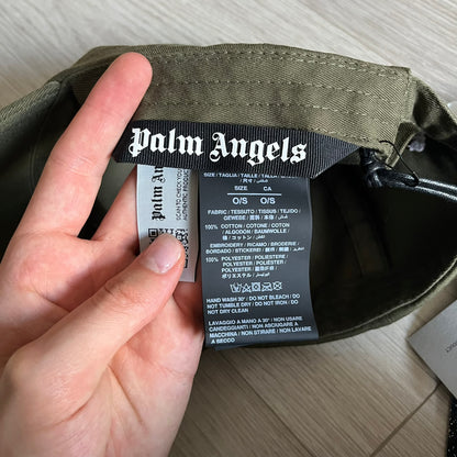 Palm Angels Classic Logo Khaki Baseball Cap made from 100% cotton with white embroidered Palm Angels lettering on both the front and back. Designed with gothic-inspired typography, this cap delivers a clean, minimal look with a streetwear edge.
