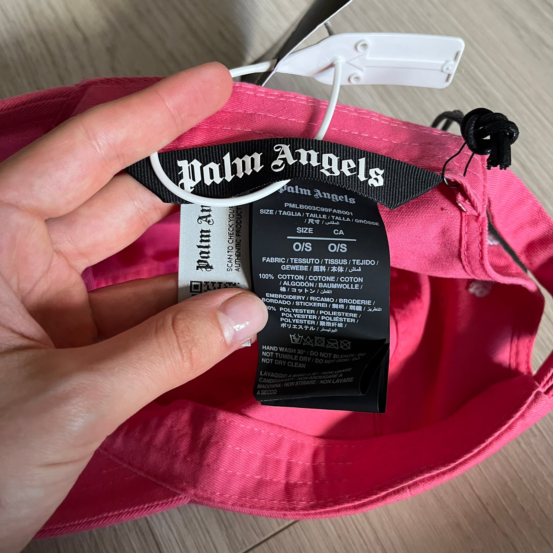 Palm Angels Classic Logo Pink Baseball Cap crafted from 100% cotton. Features white embroidered Palm Angels logos on the front and back in gothic-inspired lettering. A clean, minimal statement piece with a bold color pop.