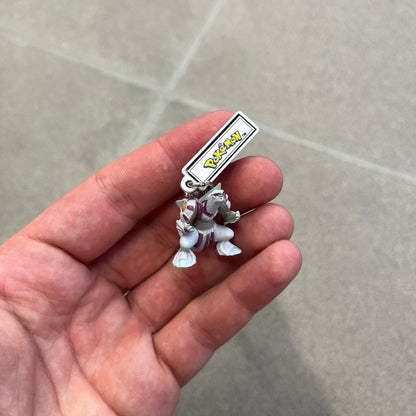 Pokémon 2008 Palkia Necklace is a converted Palkia key chain turned into a wearable pendant. It features a small 3D Palkia figure from the Pokémon franchise with an attached Pokémon tag containing licensing details on the back. The pendant design comes from a 2008 key chain release.