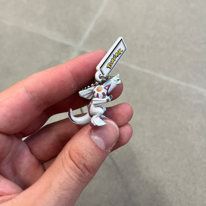 Pokémon 2008 Palkia Necklace is a converted Palkia key chain turned into a wearable pendant. It features a small 3D Palkia figure from the Pokémon franchise with an attached Pokémon tag containing licensing details on the back. The pendant design comes from a 2008 key chain release.