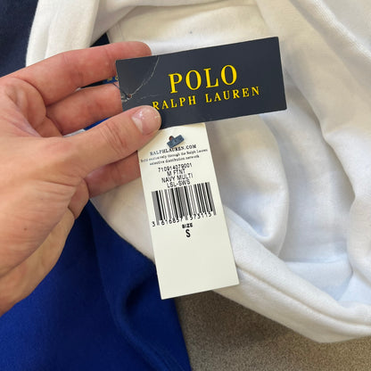 Polo Ralph Lauren x Fortnite 2022 Hoodie featuring a two-tone split design in blue and navy with a white hood. The front showcases a large white panel with “2022” text, Ralph Lauren Est. 1967 branding, and a Fortnite logo, along with an oversized embroidered Polo logo above. A limited collaboration piece with paper tags.