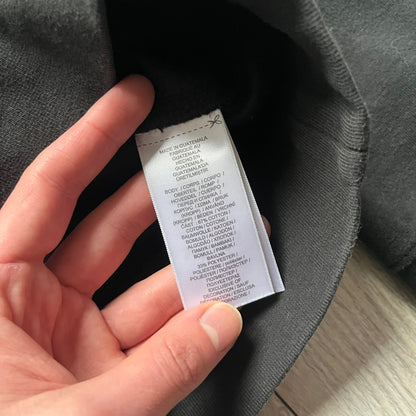 Polo Ralph Lauren x Fortnite black hoodie featuring a detailed embroidered purple Fortnite llama with the RL rider logo placed on top. Made from a 66% cotton and 34% polyester blend, it has a classic pullover construction with an attached hood and front kangaroo pocket. The embroidery is positioned on the left chest and stands out with clean stitching and sharp detail.