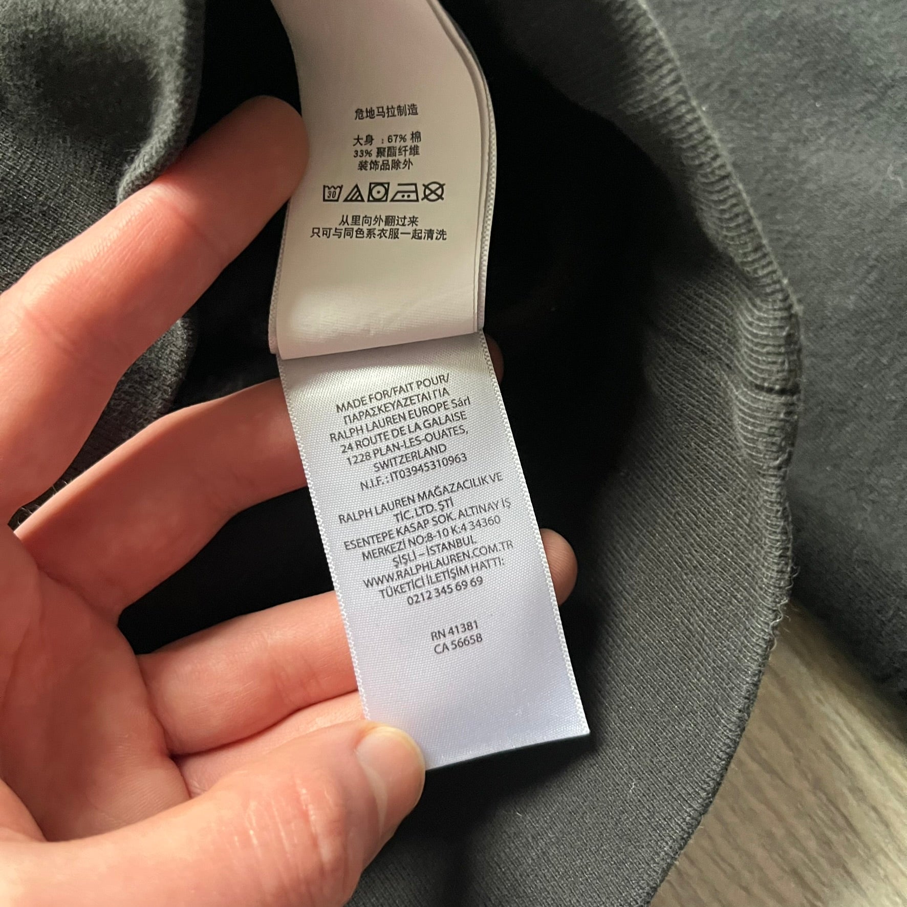 Polo Ralph Lauren x Fortnite black hoodie featuring a detailed embroidered purple Fortnite llama with the RL rider logo placed on top. Made from a 66% cotton and 34% polyester blend, it has a classic pullover construction with an attached hood and front kangaroo pocket. The embroidery is positioned on the left chest and stands out with clean stitching and sharp detail.