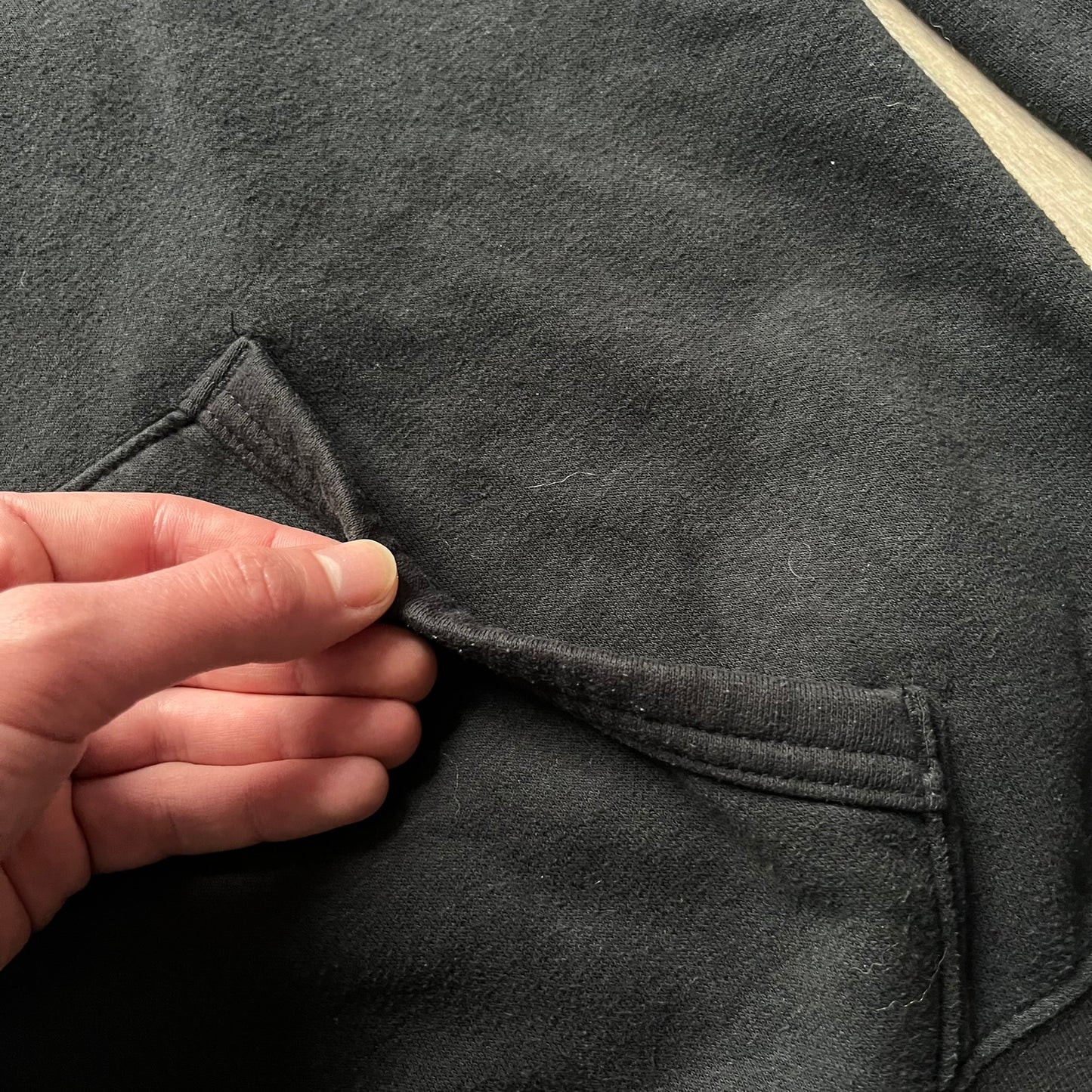 Polo Ralph Lauren x Fortnite black hoodie featuring a detailed embroidered purple Fortnite llama with the RL rider logo placed on top. Made from a 66% cotton and 34% polyester blend, it has a classic pullover construction with an attached hood and front kangaroo pocket. The embroidery is positioned on the left chest and stands out with clean stitching and sharp detail.