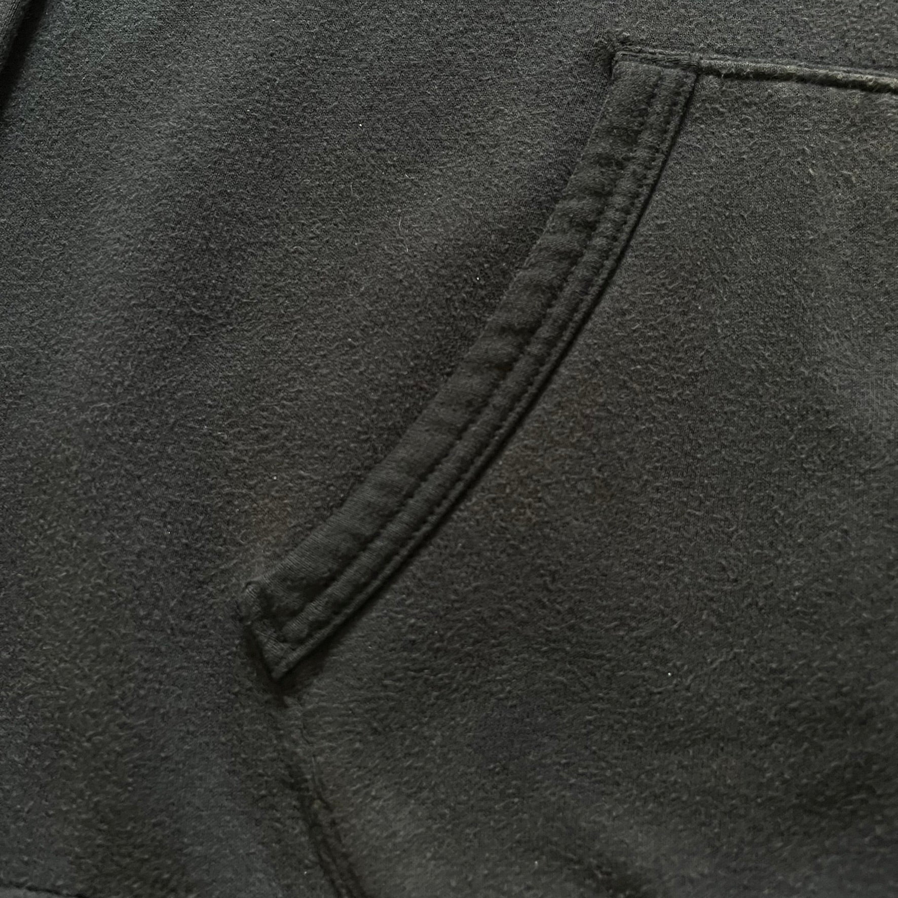  Polo Ralph Lauren x Fortnite black hoodie featuring a detailed embroidered purple Fortnite llama with the RL rider logo placed on top. Made from a 66% cotton and 34% polyester blend, it has a classic pullover construction with an attached hood and front kangaroo pocket. The embroidery is positioned on the left chest and stands out with clean stitching and sharp detail.