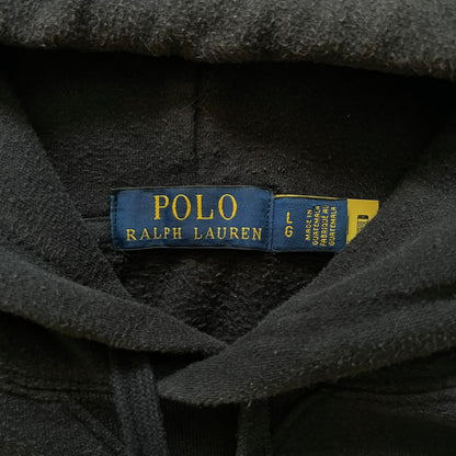  Polo Ralph Lauren x Fortnite black hoodie featuring a detailed embroidered purple Fortnite llama with the RL rider logo placed on top. Made from a 66% cotton and 34% polyester blend, it has a classic pullover construction with an attached hood and front kangaroo pocket. The embroidery is positioned on the left chest and stands out with clean stitching and sharp detail.