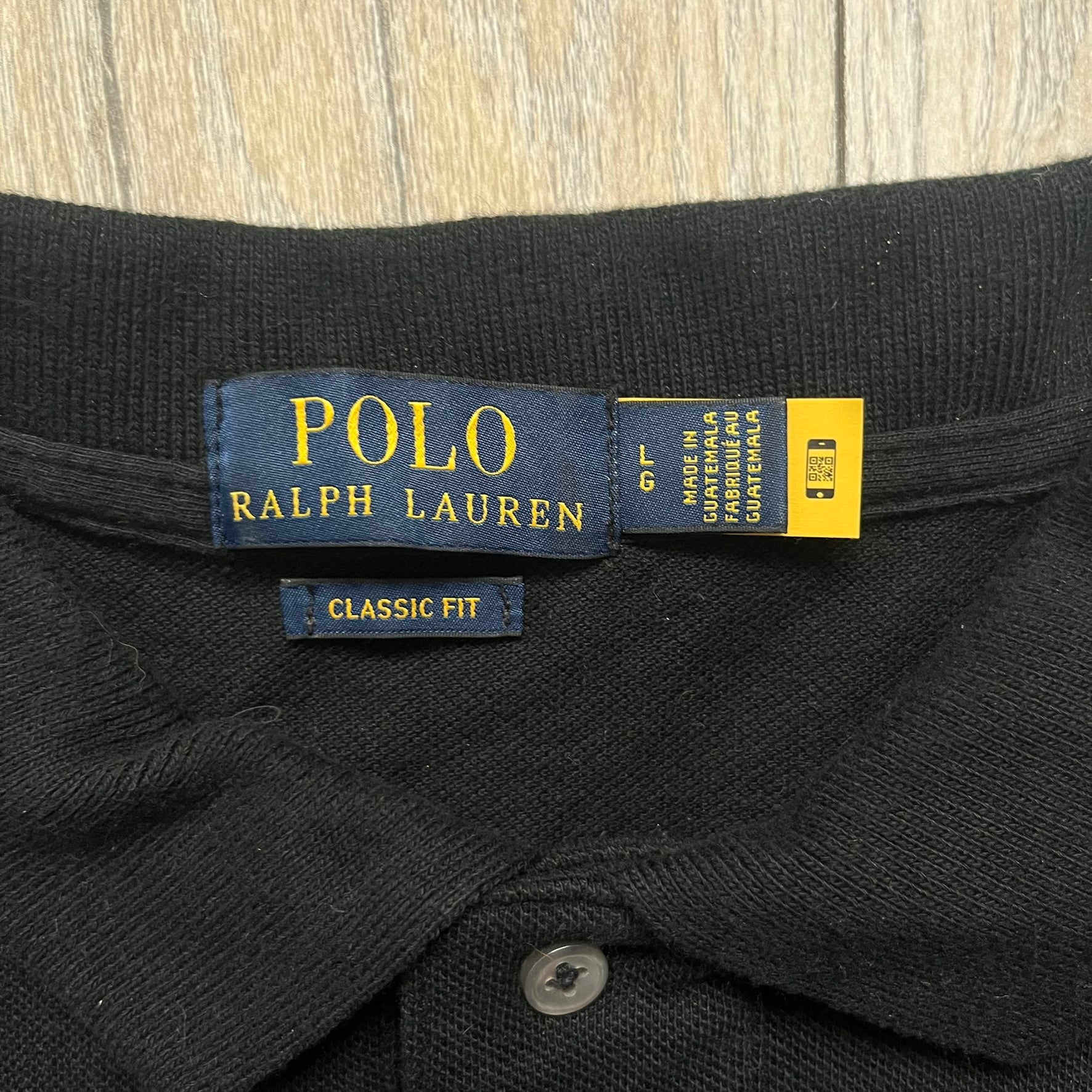Polo Ralph Lauren x Fortnite 2022 Embroidered Llama Polo is a black cotton polo shirt from the 2022 collaboration collection. It features a classic fit with a two-button collar design and an embroidered chest logo replacing the traditional Ralph Lauren horse with the iconic Fortnite llama in purple and blue tones. Made from 100% cotton.