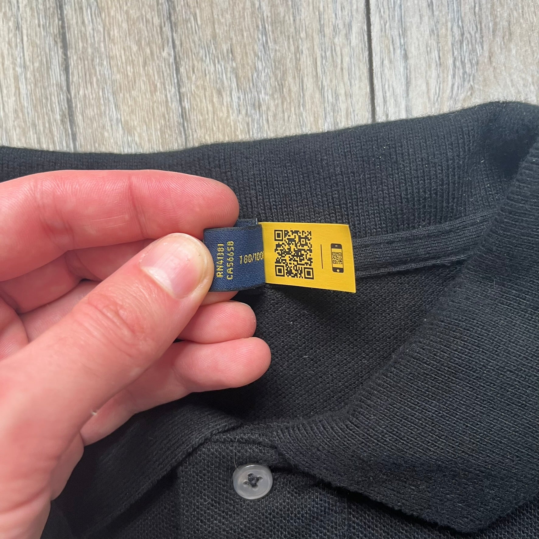Polo Ralph Lauren x Fortnite 2022 Embroidered Llama Polo is a black cotton polo shirt from the 2022 collaboration collection. It features a classic fit with a two-button collar design and an embroidered chest logo replacing the traditional Ralph Lauren horse with the iconic Fortnite llama in purple and blue tones. Made from 100% cotton.