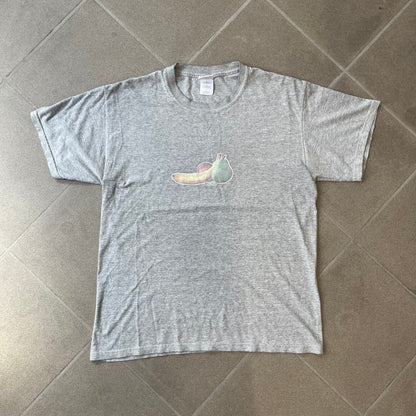 Porn Star Clothing 90's Fruits Gray Tee features a grey T-shirt with an apple, banana, and pear graphic on the chest, arranged as a you know what. A small Porn Star logo is printed underneath, with the “Good Clothing for Bad People” branding on the neck tag. The shirt has two professionally repaired holes under the armpits.