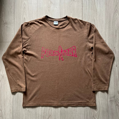 Vintage 90’s Porn Star Clothing longsleeve in brown, featuring a bold pink logo on the chest with a silhouette outline of a woman between the words “Porn” and “Star.” Crafted with quality construction, it carries the brand’s signature edgy aesthetic. Finished with a playful “must be 18 or over” detail on the tag, this rare piece embodies 90’s streetwear provocative style.