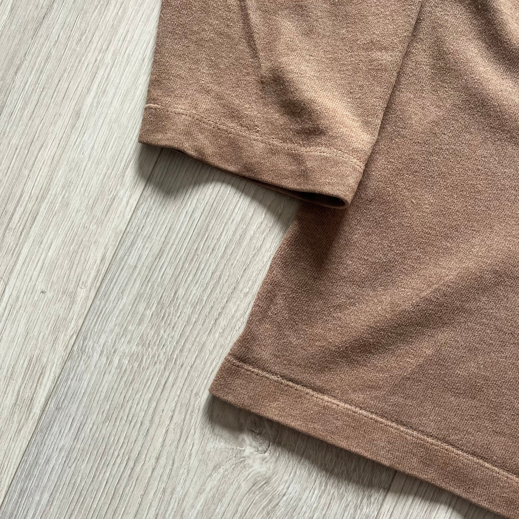 Vintage 90’s Porn Star Clothing longsleeve in brown, featuring a bold pink logo on the chest with a silhouette outline of a woman between the words “Porn” and “Star.” Crafted with quality construction, it carries the brand’s signature edgy aesthetic. Finished with a playful “must be 18 or over” detail on the tag, this rare piece embodies 90’s streetwear provocative style.