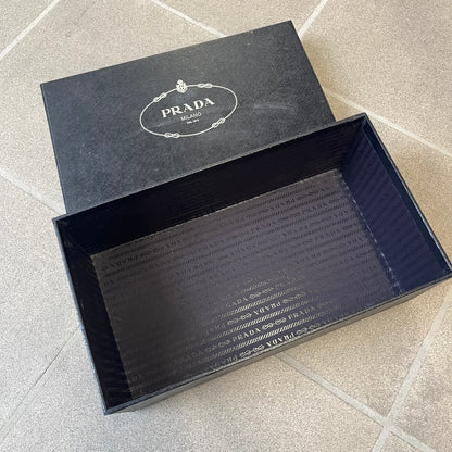 Prada 2000's Patent Leather Magenta Kitten Heels are made in Italy from magenta patent leather with a beige interior and sole, featuring a gold-tone metal Prada logo on the bottom and Prada branding on the insole. They come with the original box and two dust bags; the bottom and heel tip have been professionally repaired.