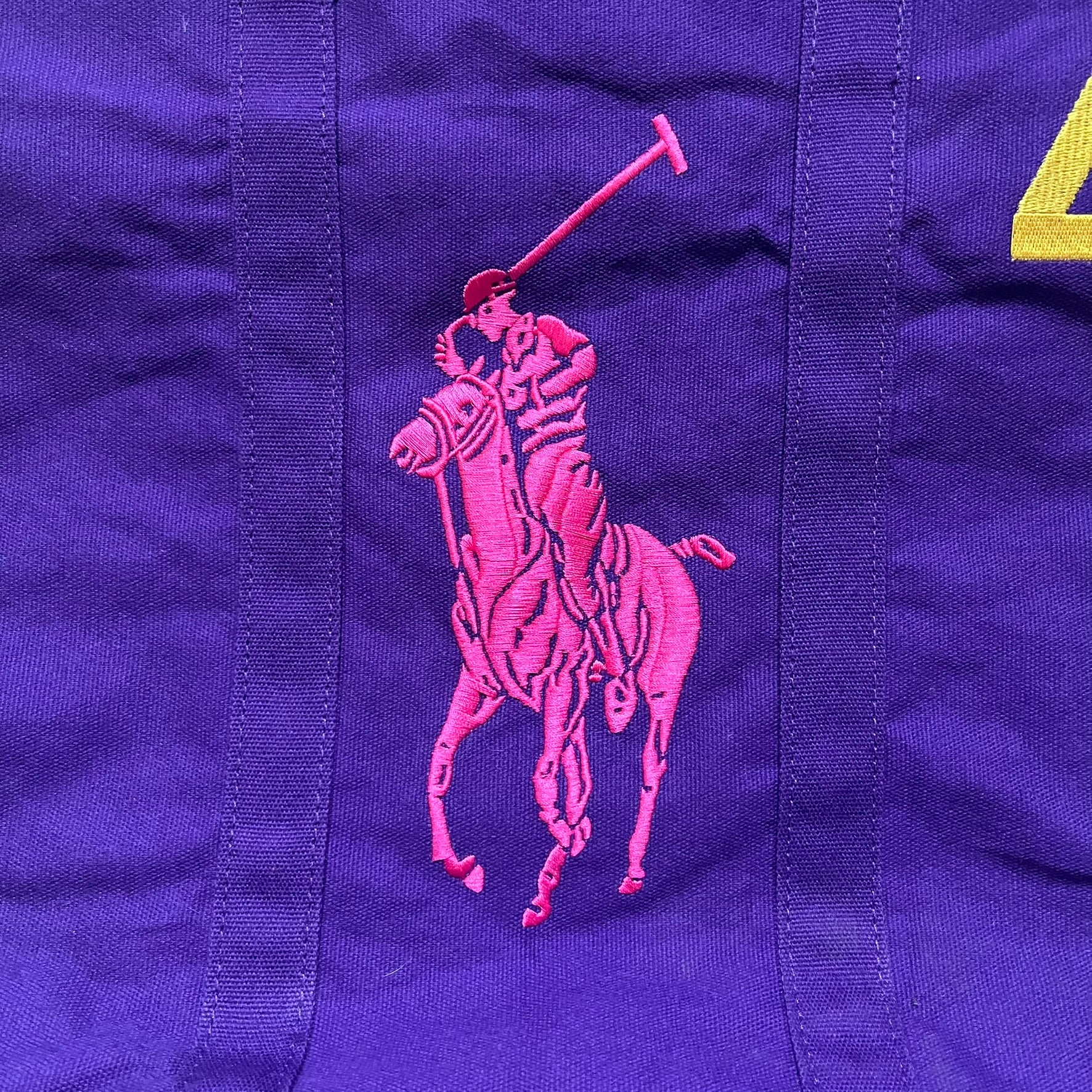 Ralph Lauren Purple &amp; Pink 4 thick tote bag with a large pink embroidered RL horse logo on the front. Yellow number "4" on the upper right. Interior is pink, made from a softer, smooth material. High-quality embroidery and sturdy exterior construction.
