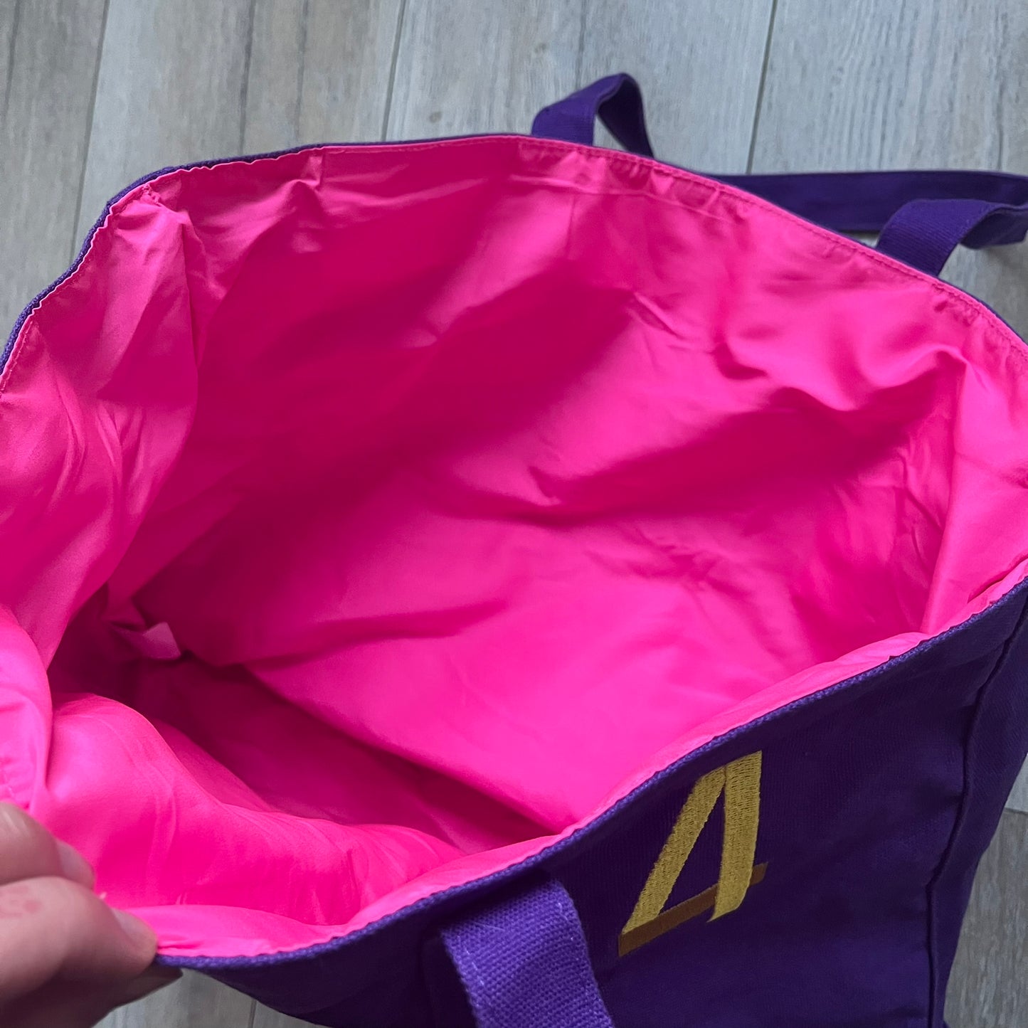 Ralph Lauren Purple &amp; Pink 4 thick tote bag with a large pink embroidered RL horse logo on the front. Yellow number "4" on the upper right. Interior is pink, made from a softer, smooth material. High-quality embroidery and sturdy exterior construction.