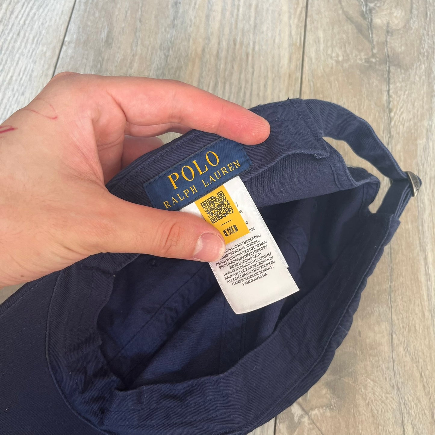 Ralph Lauren x Fortnite Navy Logo Baseball Cap is a navy cotton cap featuring bold embroidered branding on the front, including red Polo Ralph Lauren text and a Fortnite logo patch combined with a USA Ralph Lauren crest. The back includes a white embroidered Ralph Lauren logo and an adjustable strap for a custom fit.