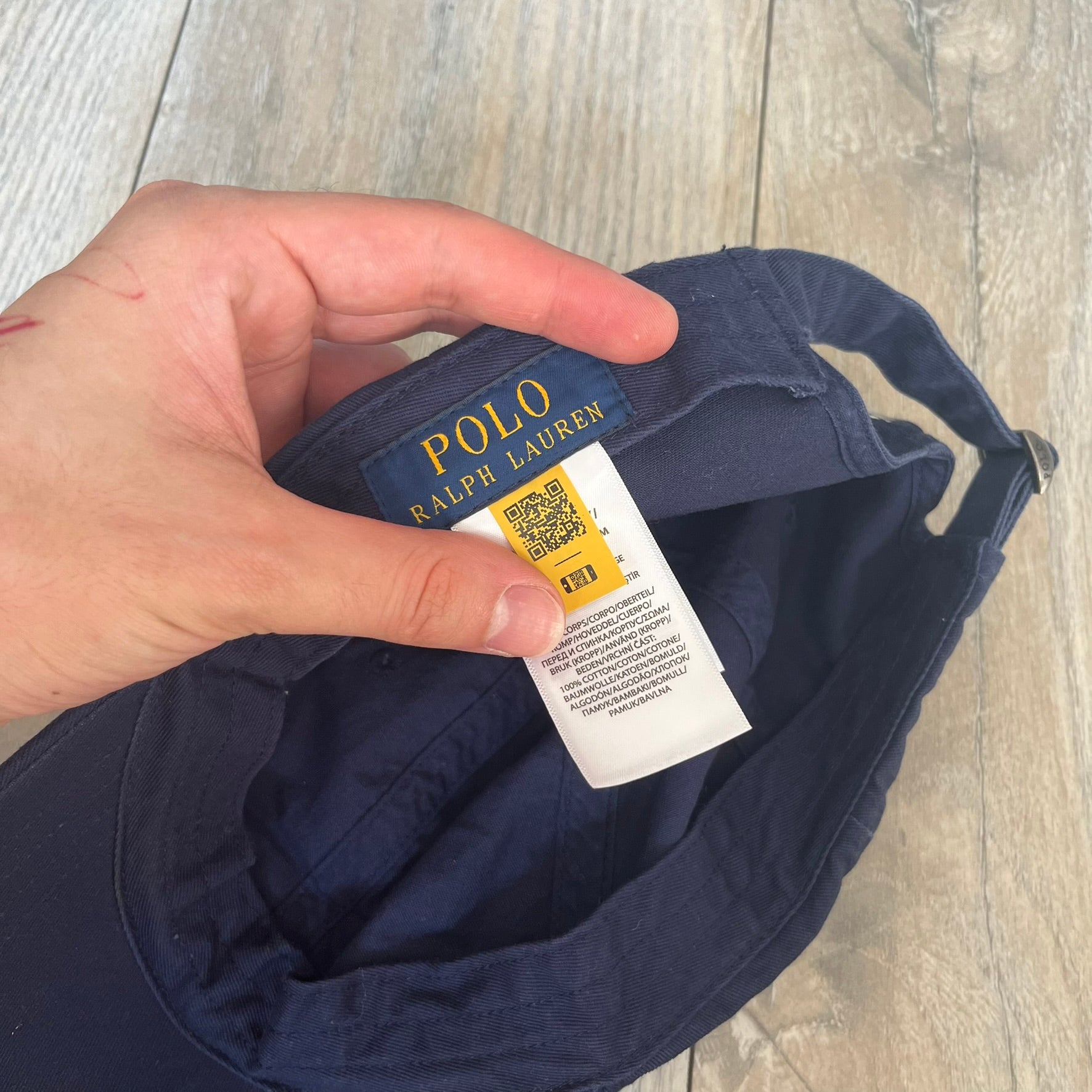 Ralph Lauren x Fortnite Navy Logo Baseball Cap is a navy cotton cap featuring bold embroidered branding on the front, including red Polo Ralph Lauren text and a Fortnite logo patch combined with a USA Ralph Lauren crest. The back includes a white embroidered Ralph Lauren logo and an adjustable strap for a custom fit.